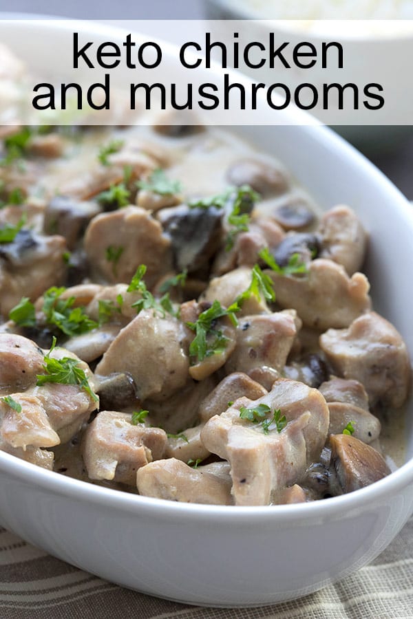 Keto Chicken and Mushrooms in a white dish, with a sprinkle of parsley