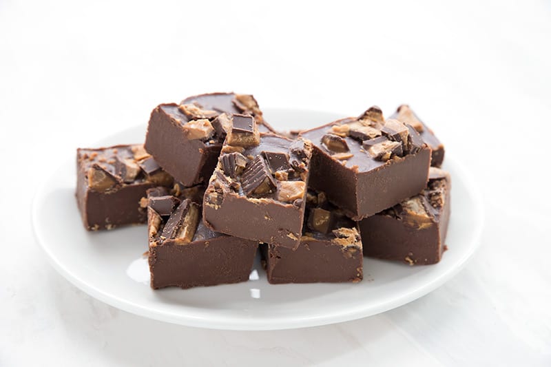Easy chocolate peanut butter fudge on a white plate. 