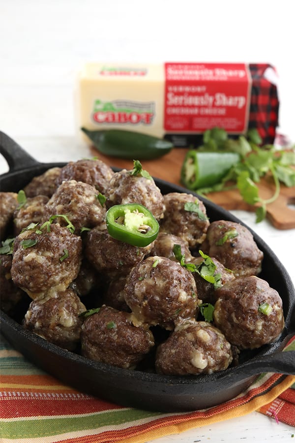 Keto meatballs made with Cabot Cheddar in a casserole dish.