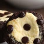 Close up shot of two Keto Chocolate Cheesecake Muffins on a white plate, with the title across the top.