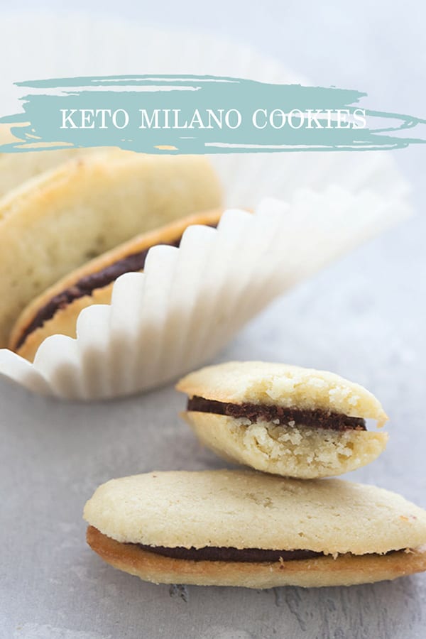 Title image of homemade keto milano cookies in a pile, and one has a bite taken out of it. 