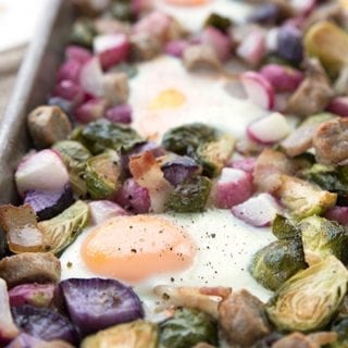Close up of keto sheet pan breakfast with veggies, eggs, bacon and sausage