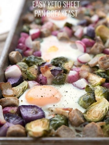 Close up of keto sheet pan breakfast with veggies, eggs, bacon and sausage