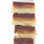 Titled image of a stack of Keto Twix Bars on a white background.