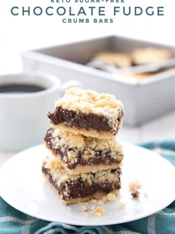 Titled image of a stack of keto fudge crumb bars on a white plate over a teal plaid napkin