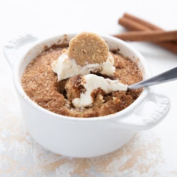 Close up shot of keto mug cake with a spoon stuck into it.