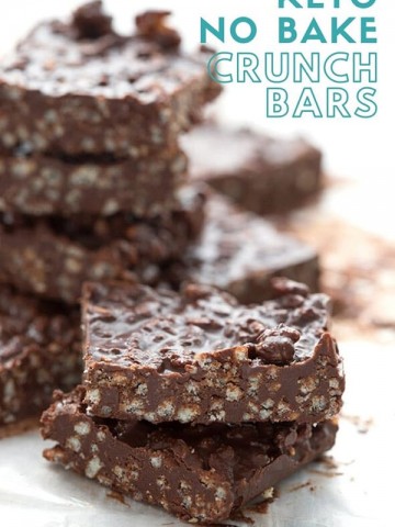 Titled image of keto no bake chocolate crunch bars in a stack, with two bars close up in front.