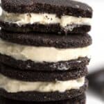 A stack of Keto Oreo cookies with a bite taken out of the top one.