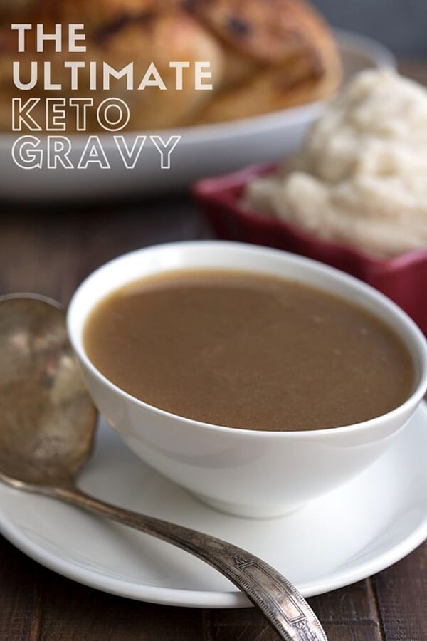 Titled image of keto gravy in a white bowl with a roast turkey in the background