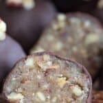 Close up image of a Keto Pecan Pie Truffle cut open to show the inside.