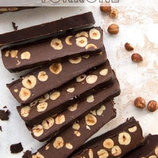 Titled image of keto chocolate torrone. Top down photo of slices of torrone cut to expose the hazelnuts