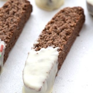 Close up shot of keto gingerbread biscotti dipped in sugar-free white chocolate