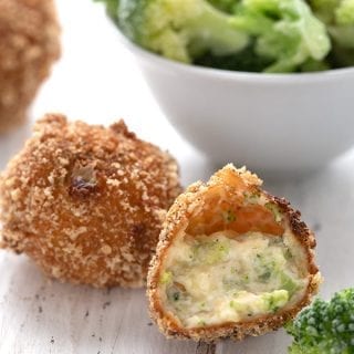 Close up shot of keto broccoli cheddar bites in front of a bowl of broccoli