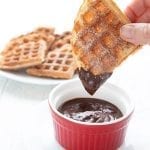 Dipping a keto churro waffle in sugar-free chocolate sauce.