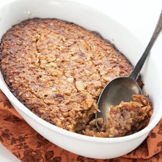 Titled image of baked keto oatmeal in a dish with a spoon scooping some out