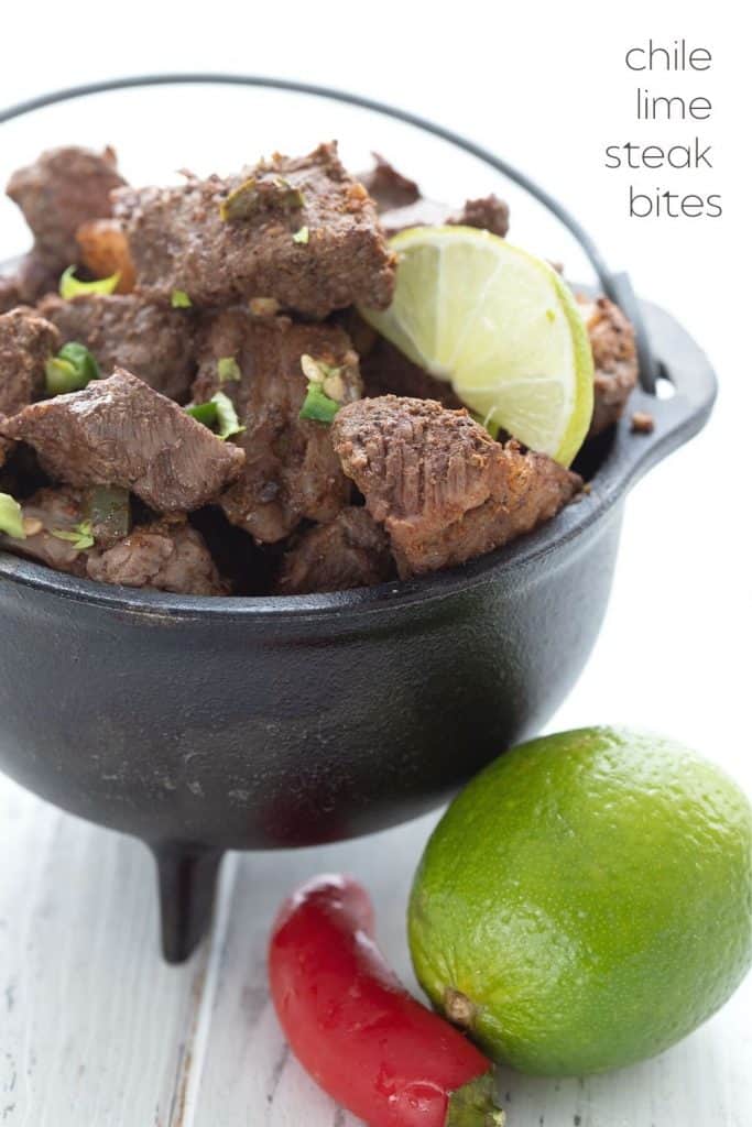 Titled image of a cast iron bowl of keto chili lime steak bites