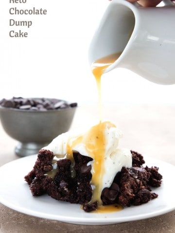 Titled image of sugar free caramel sauce pouring over a plate of keto chocolate dump cake.