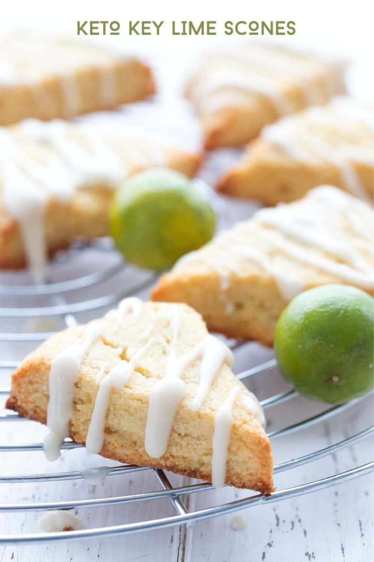 Glazed sugar free scones on a cooling rack over a white table.