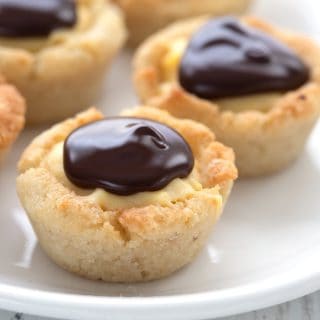 Close up shot of Keto Boston Cream Cookie Cups on a white plate.