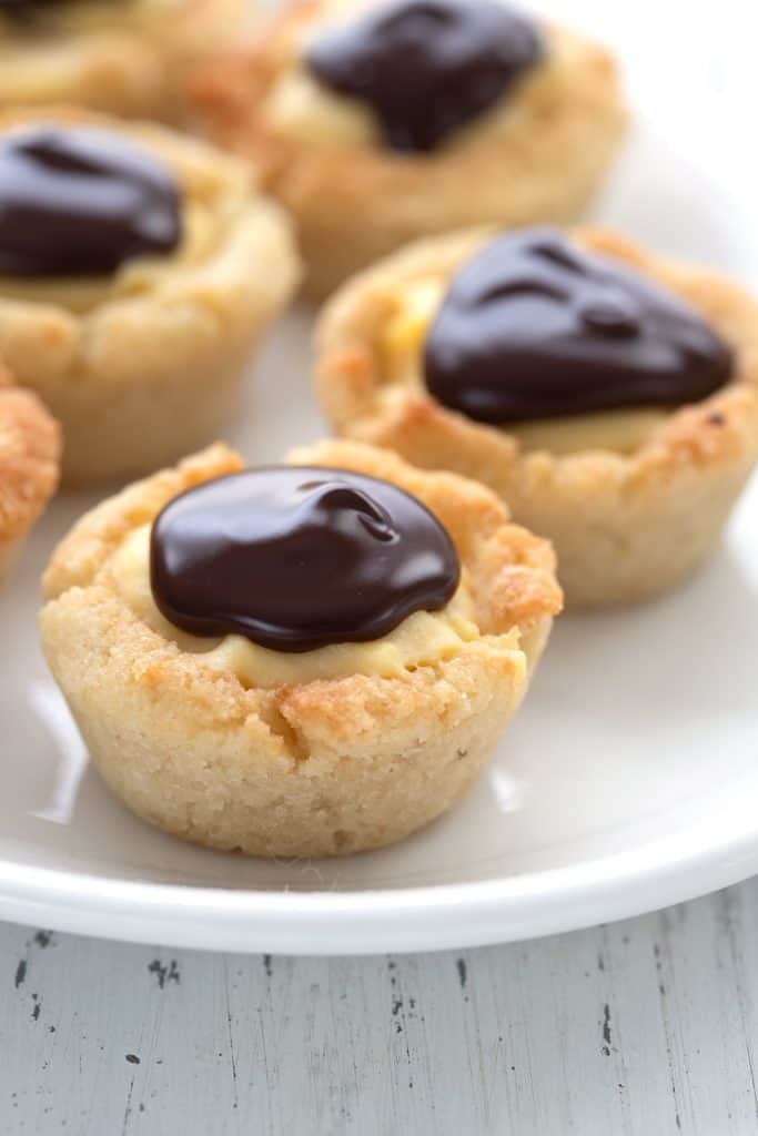 Close up shot of Keto Boston Cream Cookie Cups on a white plate.
