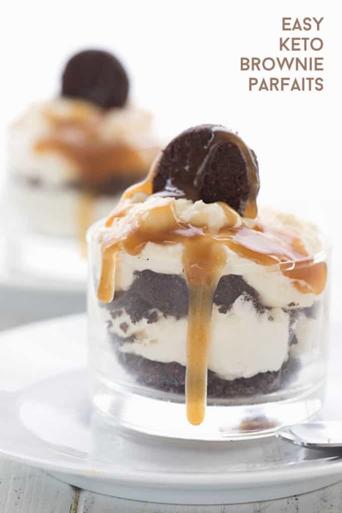 Titled image of keto brownie parfaits in glass dessert cups with sugar free caramel sauce dripping down.