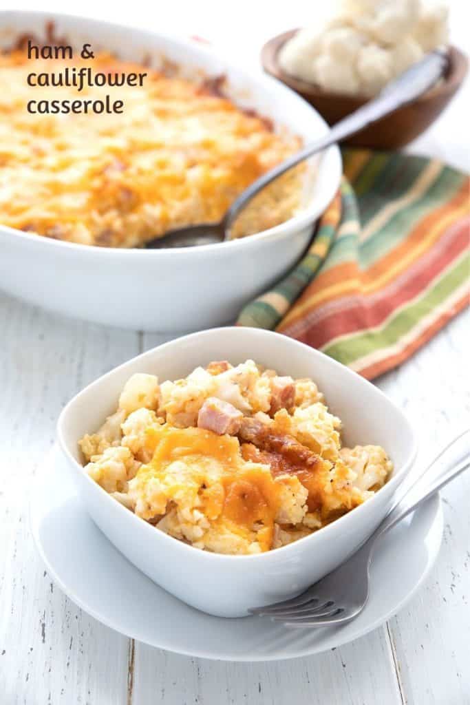 Titled image of keto ham and cauliflower casserole in a small dish, in front of the larger casserole