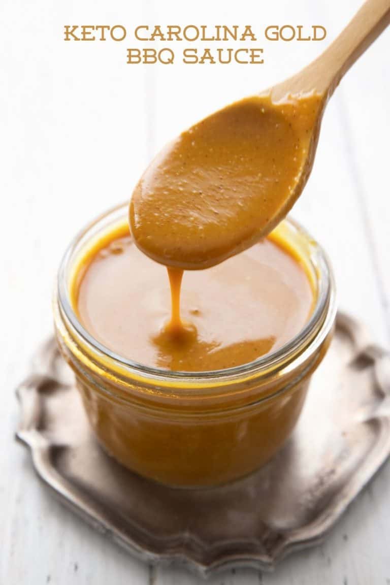 Titled image of a jar of keto Carolina Gold BBQ Sauce with a spoon lifting some out of the jar.