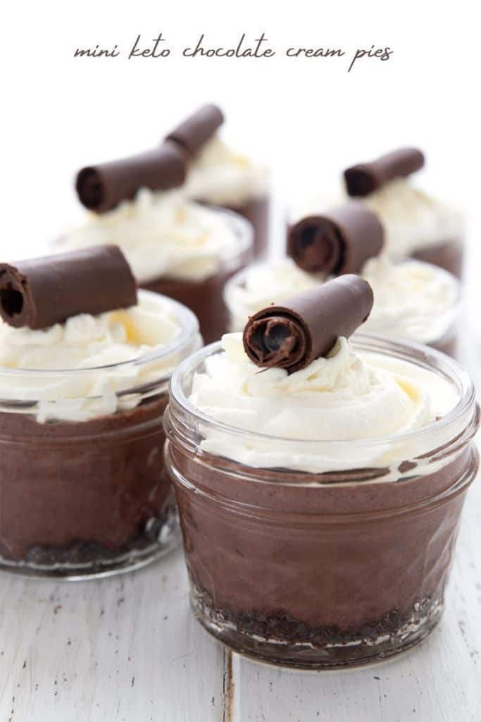 Titled image of 6 mini keto chocolate cream pies in glass jars on a white table