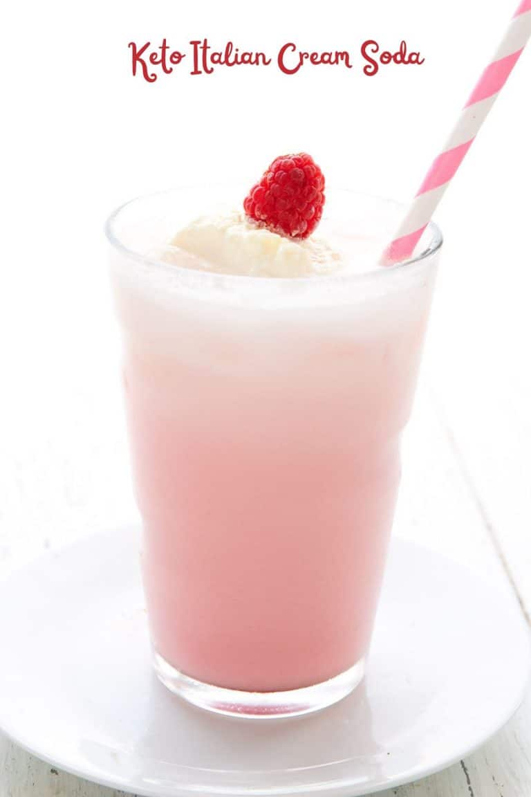 Titled image of a glass of sugar free Italian Cream Soda with a pink striped straw.