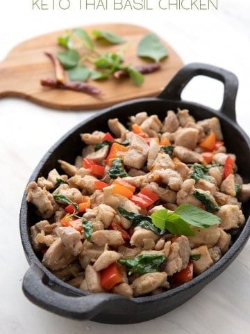Titled image of Keto Thai Basil Chicken in a cast iron pan.