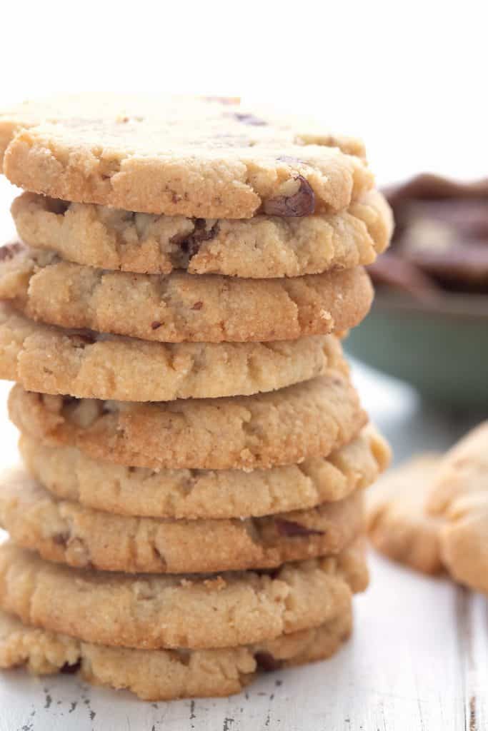 A stack of low carb pecan cookies on a white table.