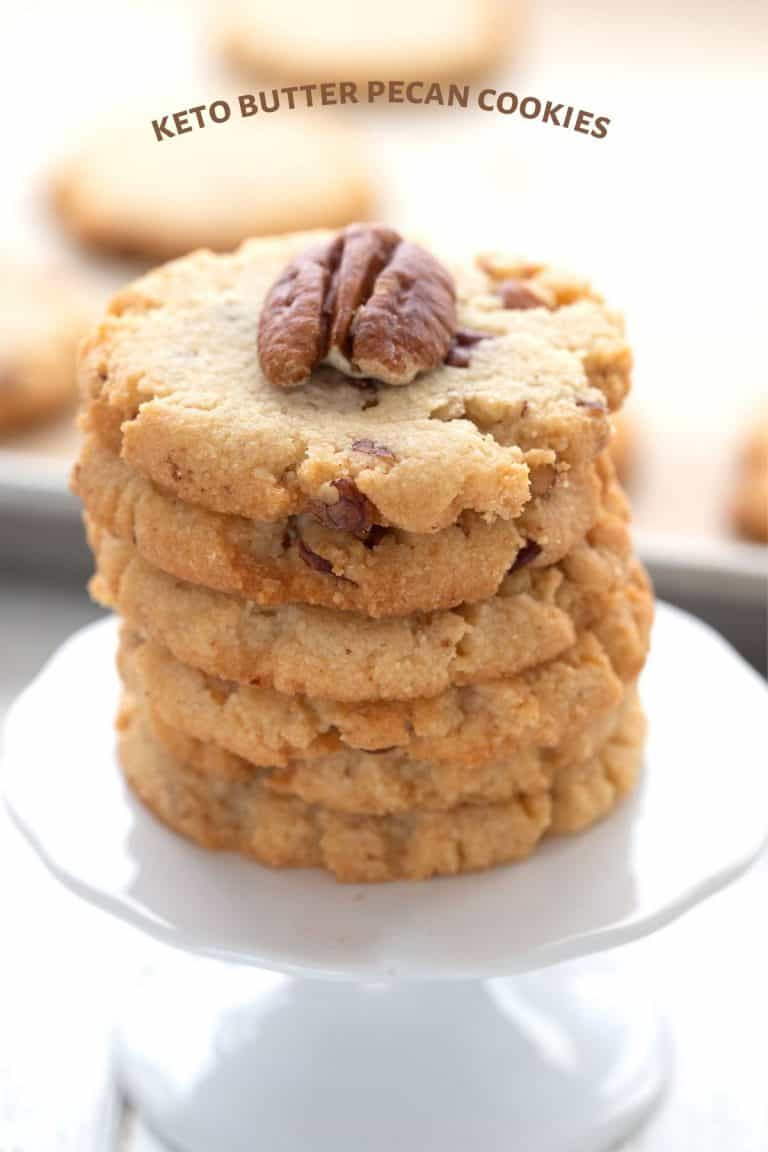 Titled image of a stack of keto butter pecan cookies on a cupcake stand.