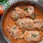 Top down image of a pan of creamy tomato basil chicken with the title curving around the edge of the pan.