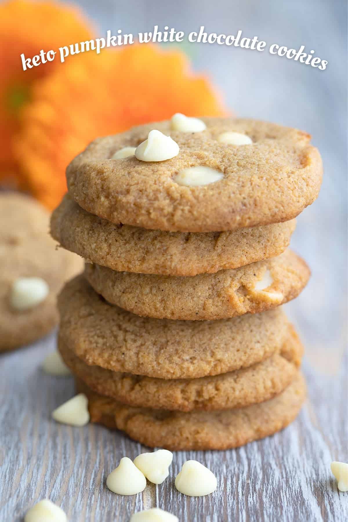Titled image of keto pumpkin cookies with white chocolate chips in a stack.