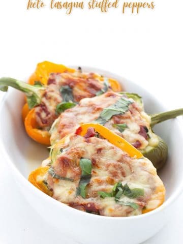 Titled image of keto lasagna stuffed peppers in a white ceramic baking dish.