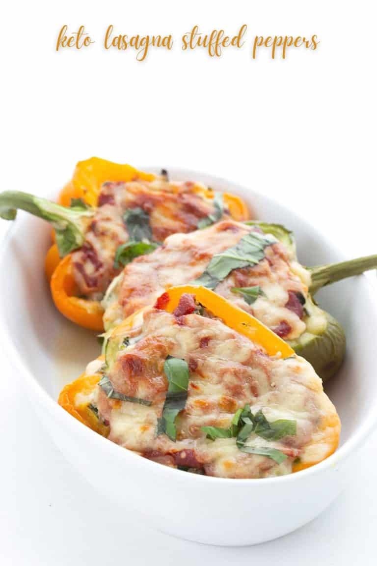 Titled image of keto lasagna stuffed peppers in a white ceramic baking dish.