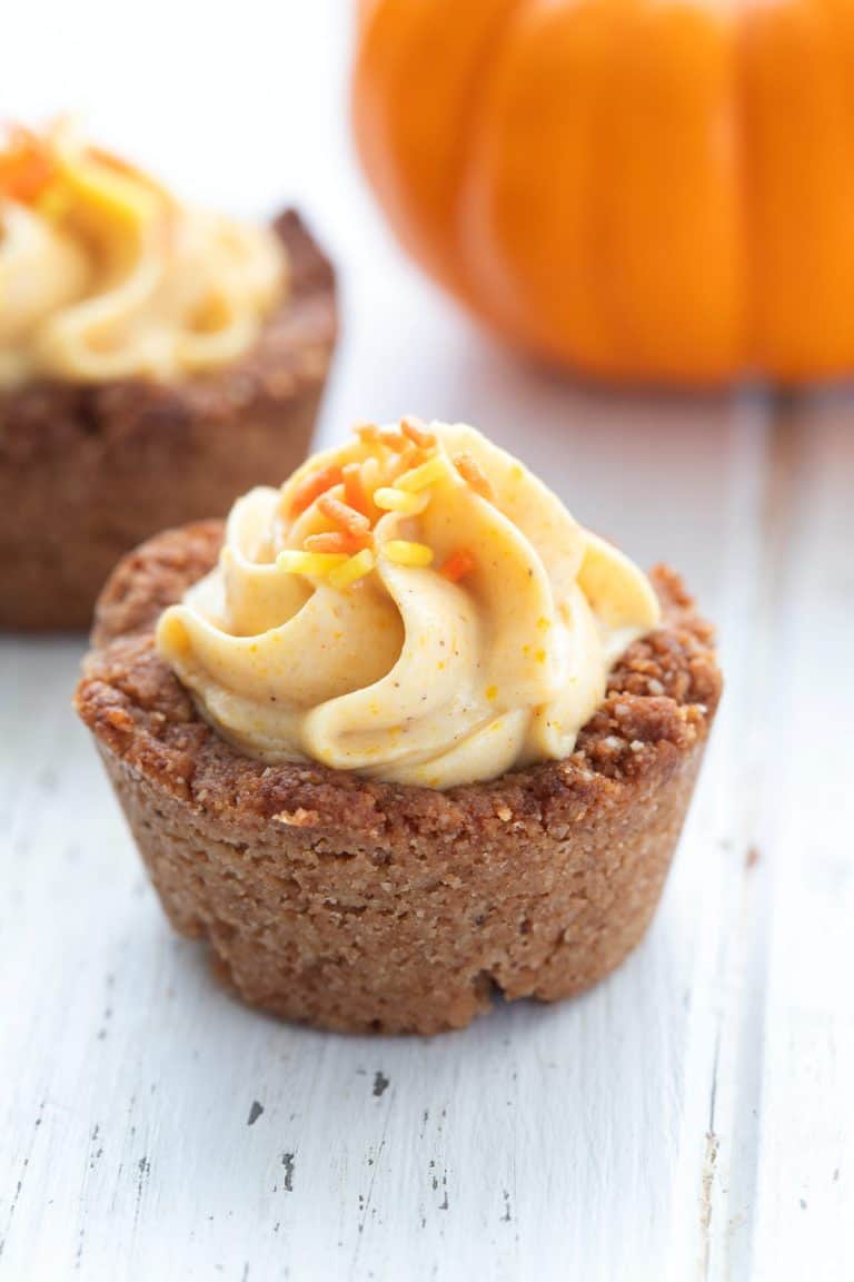 A close up of a keto pumpkin cheesecake bite with sugar free sprinkles on top.