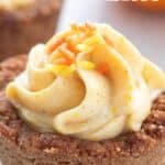 Titled image of a keto pumpkin cheesecake bite close up, on a white table.