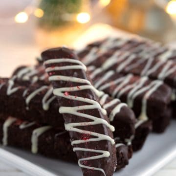 Close up shot of keto chocolate peppermint biscotti on a white plate.