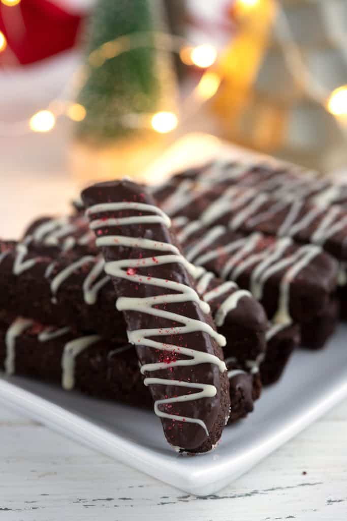 Close up shot of keto chocolate peppermint biscotti on a white plate.