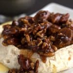 Keto baked brie with a pecan praline topping.