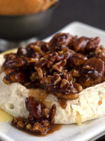 Keto baked brie with a pecan praline topping.