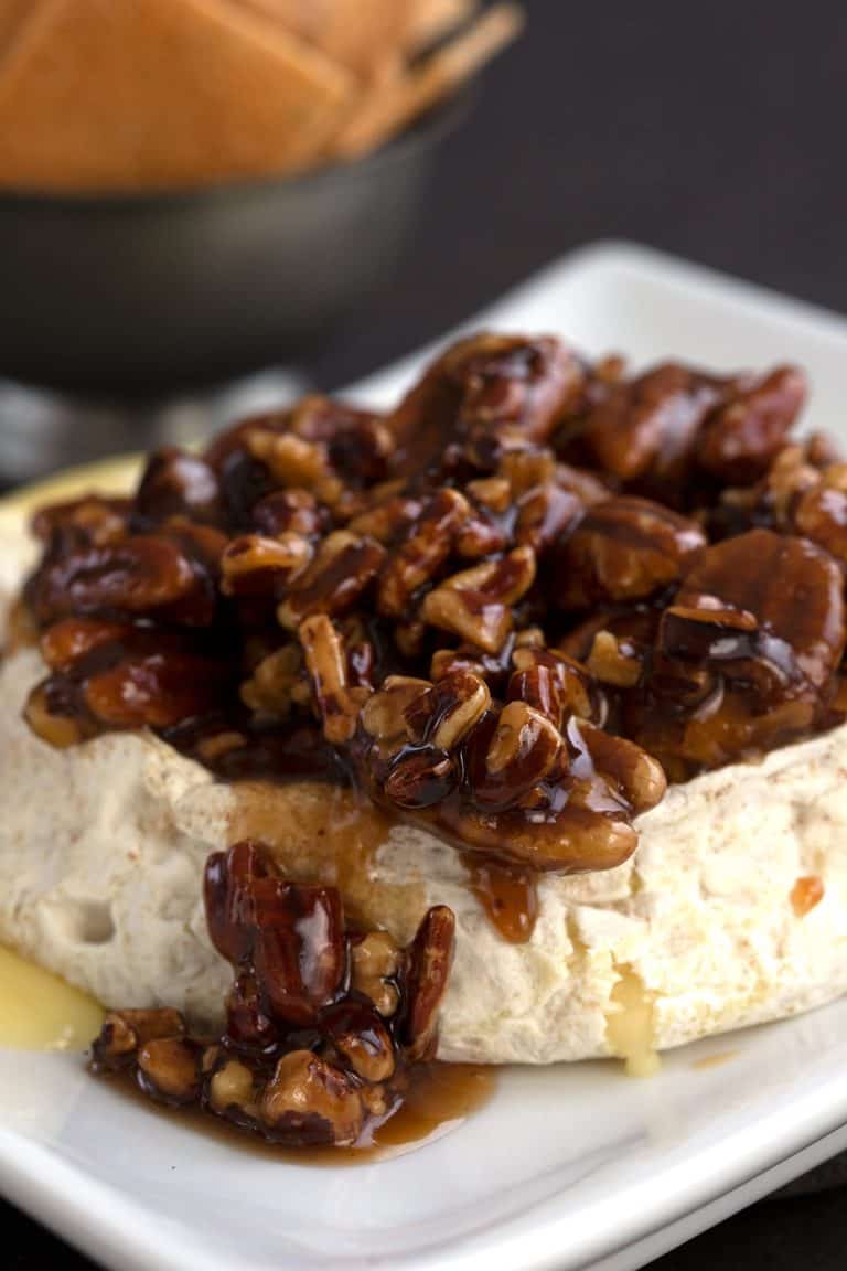 Keto baked brie with a pecan praline topping.