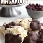 A plate of keto macaroons with cranberries, almonds, and chocolate on a red napkin.