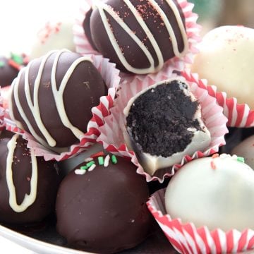 Close up shot of keto peppermint truffles with a bite taken out of one.