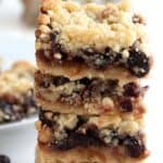 Titled image of a stack of keto mincemeat bars on a white table.