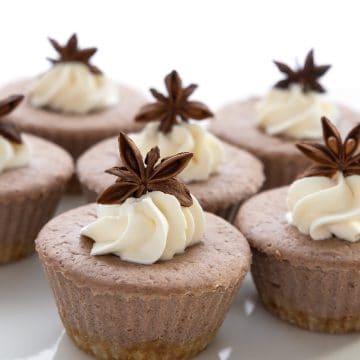 Close up shot of gingerbread cheesecakes on a white platter.