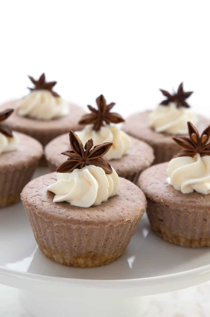 Close up shot of gingerbread cheesecakes on a white platter.
