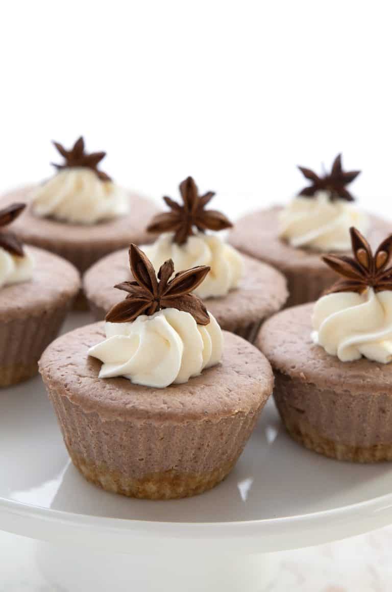 Close up shot of gingerbread cheesecakes on a white platter.