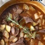 Top down image of Keto Beef Stew in a blue dutch oven.